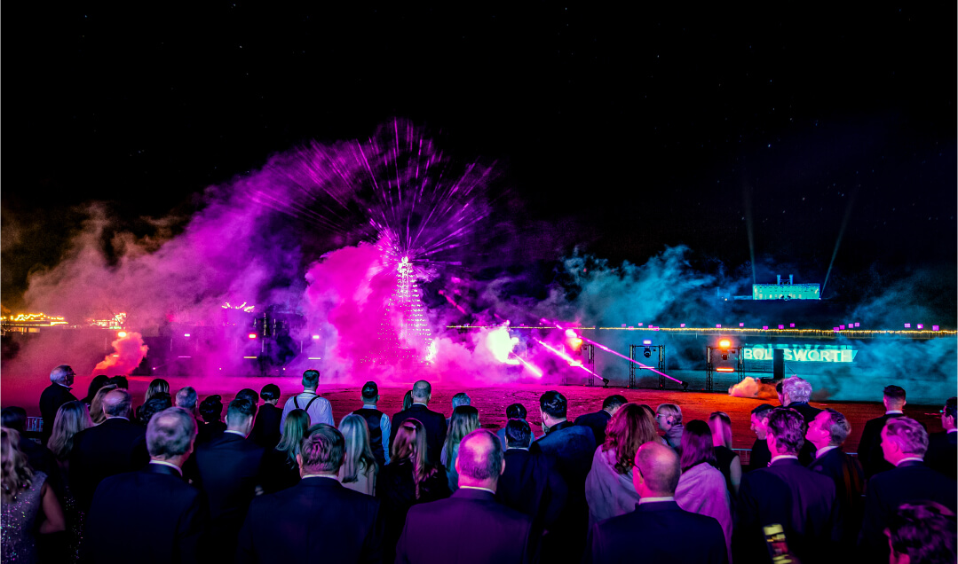 Firework display over the Bolesworth grounds as guests enjoying the vibrant atmosphere.