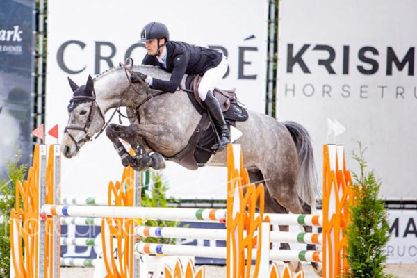 A stunning grey showjumper, Malus LVP Z, demonstrates incredible scope and agility as it soars over an intricate course. Originally acquired at an Elite Auction, this horse is now excelling in the international showjumping circuit, showcasing strength, precision, and competitive excellence.