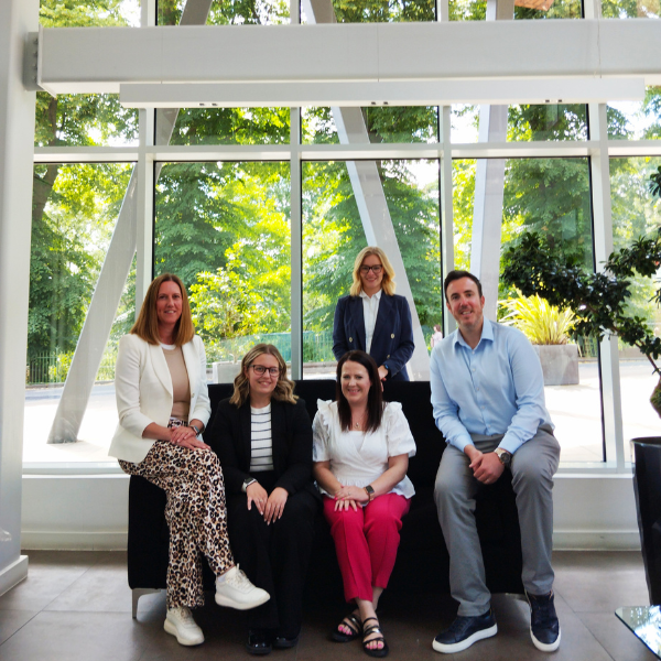 HM Legal team, partners of Bolesworth Estate, posing for a professional group photo in a modern office space.