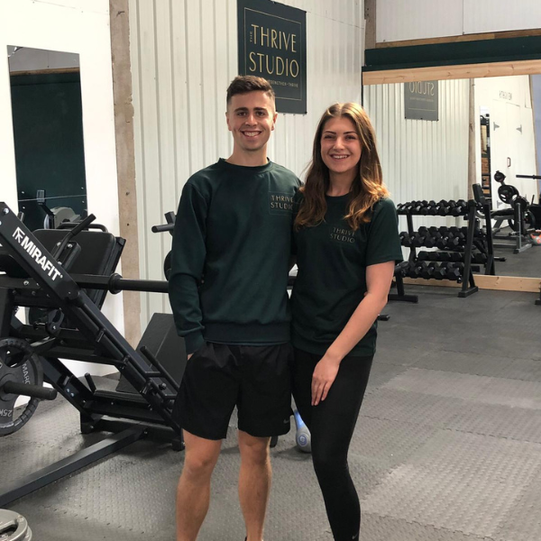 Jack and Moly, co-founders of Thrive Studio, standing in their gym at New Russia Hall near Tattenhall.